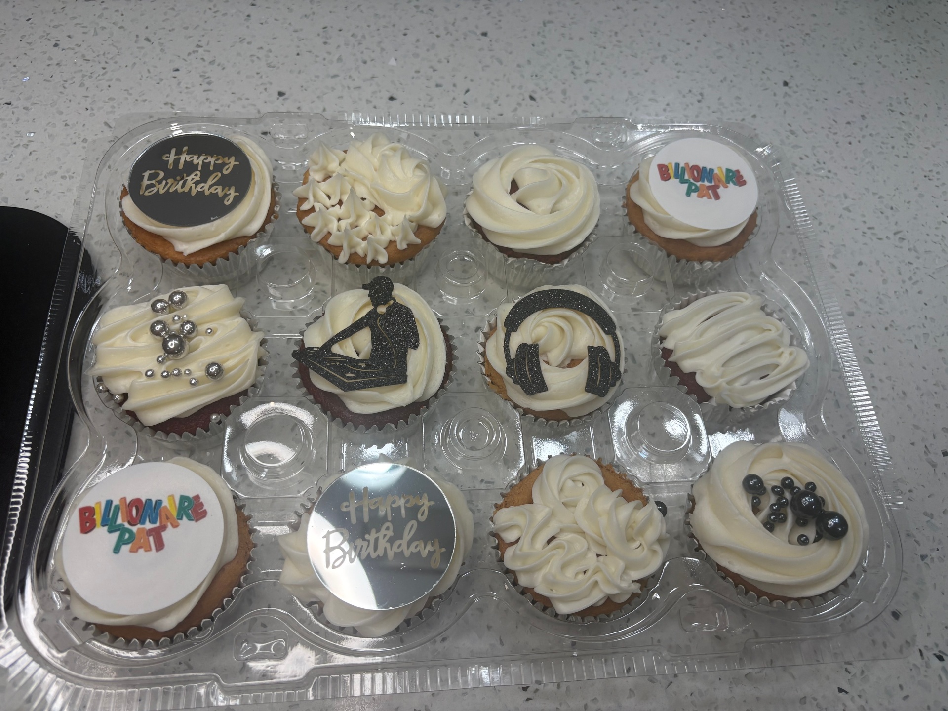 Custom black and gold cupcakes